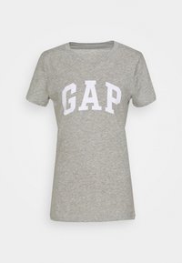 Šedé bavlněné tričko s krátkým rukávem, na přední straně s bílým logem "GAP" umístěným na hrudi. Klasický kulatý výstřih, měkký materiál.