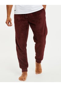 Bordeaux fleece joggers met geribde boorden en een trekkoord in de taille; zachte, gestructureerde stof voor comfort; enkellange stijl.