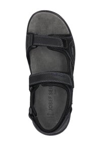 Sandalo nero con doppi cinturini in Velcro, soletta in morbido suede grigio e suola testurizzata per una maggiore aderenza e supporto.