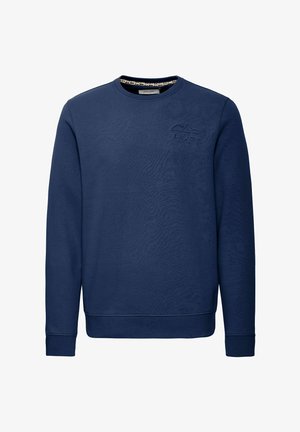 Granatowy sweter z miękkiego materiału, z okrągłym dekoltem, długimi rękawami, ściągaczami i haftowanym wzorem górskim na piersi.