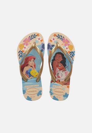Children's flip-flops with gold straps featuring Disney characters Ariel holding Flounder and Moana with Pua, decorated with flowers and sea motifs.