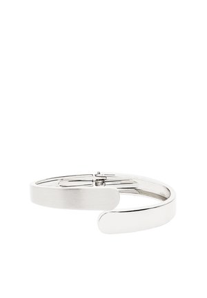 Srebrzysta bransoletka na zawiasach z gładkim, polerowanym wykończeniem i mechanizmem zapinania.