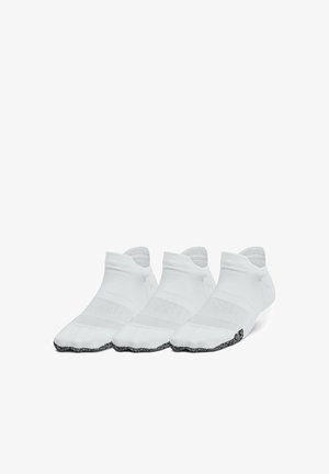 White ankle socks with a textured finish, featuring a black non-slip grip at the toe and a ribbed cuff for secure fit. Set of three pairs.