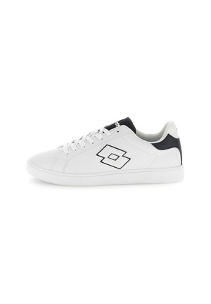 White sneakers with a smooth synthetic upper, black accents at the heel, and embroidered logo. Features round laces and a flat rubber sole.