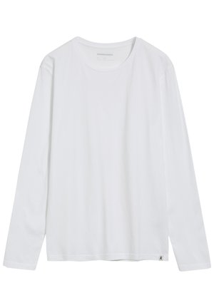 Witte t-shirt met lange mouwen van katoen. Ronde halsontwerp, rechte zoom en kleine logo label aan de onderkant links. Glad van structuur.