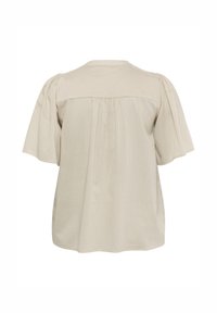 Short-sleeve beige blouse with a round neckline, pleated back, and soft texture. Features puffed sleeves and a relaxed fit.
