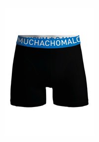 Fekete boxer alsónadrág kék derékkal, amelyen fehér "MUCHACHO" felirat található. Simább szövetből készült, szoros illeszkedéssel és minimális varratokkal rendelkezik.