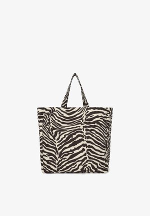 Borsa tote a righe zebrate in bianco e nero realizzata in tessuto resistente, con due manici corti e una parte superiore ampia e aperta per un facile accesso.