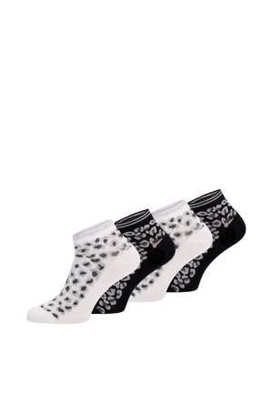 Quatre paires de chaussettes courtes alternant noir et blanc avec un motif léopard contrastant sur fond blanc.