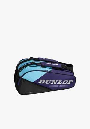 Twee blauw-zwarte Dunlop sporttassen met ritssluitingen en gewatteerde handvatten, gestapeld op een witte achtergrond.