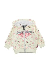 Sweat à capuche zippé jaune clair avec motifs floraux roses, doublure intérieure blanche, poches avant, et poignets et ourlet côtelés.