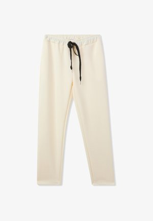 Pantaloni della tuta color crema con cintura elastica, dotati di un laccio nero e una texture liscia e morbida. Design a gamba dritta.