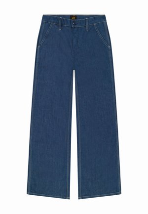Jean en denim large et bleu avec une taille haute, présentant des coutures contrastées et des poches avant standard. Fabriqué en tissu coton durable.