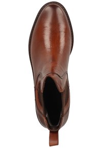 Bottes Chelsea en cuir marron avec une texture lisse, des panneaux latéraux élastiques et une languette au talon pour un enfilage facile. Présente une pointe arrondie.