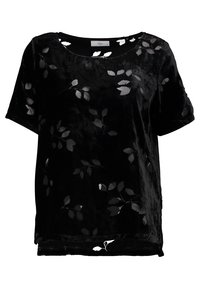 Top en velours noir à manches courtes, avec un motif de feuilles en tissu transparent. Encolure arrondie et coupe décontractée avec un ourlet droit.