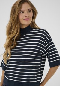 Navy and white striped knit pullover with a mock neck, short sleeves, and a relaxed fit. Soft texture, slight stretch, and horizontal pattern.