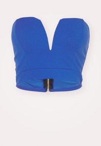 Modrá krátka blúzka s hlbokým V-výstrihom, so zapínaním na zips na zadnej strane a hladkým, elastickým materiálom.
