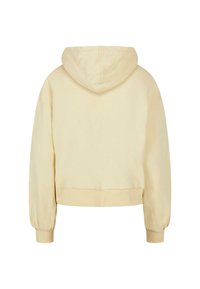 Hoodie corto color crema con cappuccio, maniche lunghe e polsini a coste. Design semplice con una texture morbida e senza decorazioni visibili.