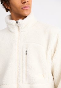 The North Face EXTREME JACKET - Fleecejacka - white dune