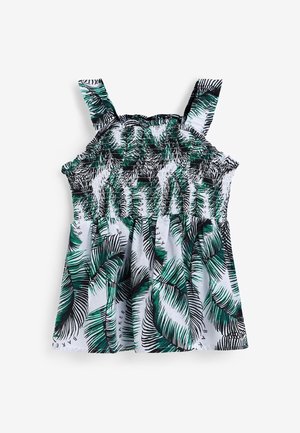 Haut sans manches fille avec imprimé feuilles tropicales vertes et noires sur fond blanc et corsage smocké.