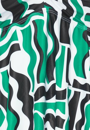 Multikleurige stof met golvende patronen in groen, zwart en wit. Gladde textuur met duidelijke vormen en contouren. Geprefabriceerd ontwerp.
