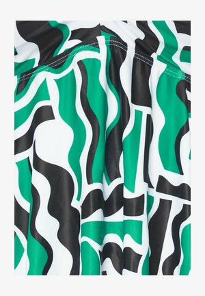 Multikleurige stof met golvende patronen in groen, zwart en wit. Gladde textuur met duidelijke vormen en contouren. Geprefabriceerd ontwerp.