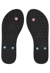 Semelles de chaussures en caoutchouc noir avec surfaces texturées. Présentent deux accents circulaires bleus et deux accents circulaires roses, répartis uniformément près du centre et des bords.