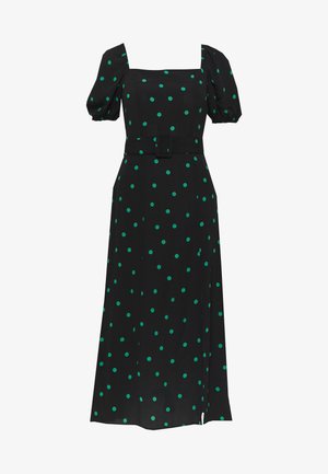 Musta mekko, jossa on puffihihat, neliömäinen pääntie, vihreitä pilkkuja, vyöllä korostettu istuva vyötärö ja puolipitkä helma. Sileä kangaspinta.