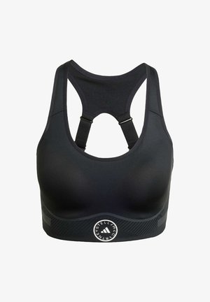 Black sports bra with a smooth finish, racerback design, adjustable straps, and a textured band featuring a logo and diagonal stripes.
