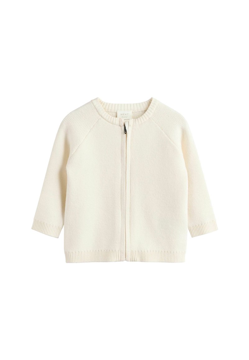 Crème-kleurige gebreide babycardigan met een ronde halslijn, ritssluiting en geribde manchetten en zoom. Heeft raglanmouwen.