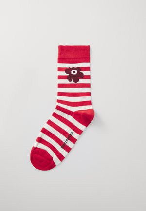 Calzino a righe rosse e bianche con un motivo floreale di un rosso scuro. Cuffia a coste, punta rossa unita e tessuto texturizzato. Etichetta del brand sul lato.