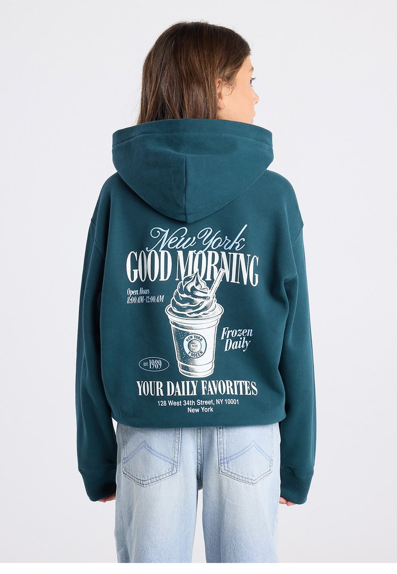 Teal sweatshirt with hood displaying white graphic print of a soft serve cup, text, and establishment details on the back. Relaxed fit.