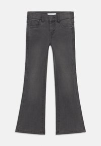 Grå utsvängda jeans i denim, med en midja som stängs med knapp, framfickor och en ren fåll.