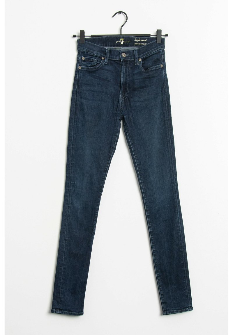 Jean skinny taille haute en denim bleu foncé. Comprend cinq poches, passants de ceinture et une fermeture éclair avec bouton. Texture lisse, coupe ajustée.
