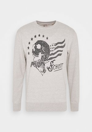 Chemise à manches longues gris clair avec graphique de crâne noir tenant une clé à molette, entouré d'étoiles et de rayures, avec le texte "Schott" à l'avant.