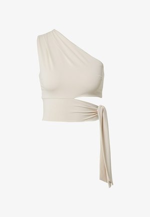 Asimetrična majica z enim ramenom iz svetlo bež tkanine, vsebuje stranski izrez in zavezan detajl v predelu pasu za prilagojen stil.