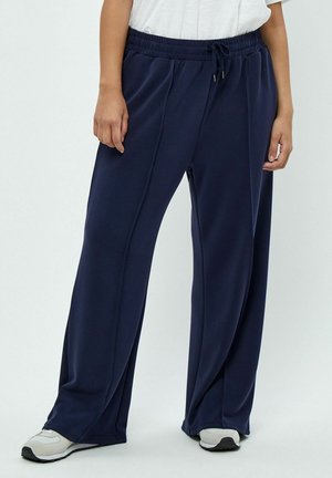 Navy blue wide-leg sweatpants made of soft fabric with an elastic waistband and drawstring, featuring side seams for a relaxed fit.
