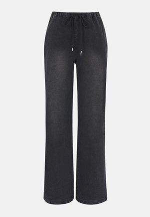 Pantalon large noir à taille élastique avec cordon de serrage, en tissu doux, présenté sur un fond clair uni.