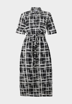 Černobílé kostkované šaty košilového střihu s krátkými rukávy, předními knoflíky, páskem v pase a sukní do poloviny stehen. Vyrobené z lehké tkaniny.