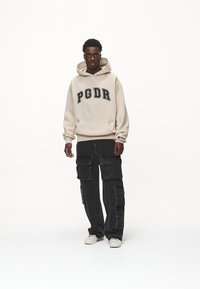 Pegador CARLO HOODIE - Jersey con capucha - washed desert sand