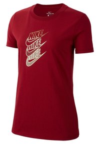 Red cotton t-shirt featuring a large graphic of the word "Nike" in varying styles and sizes. Classic crew neck and short sleeves.