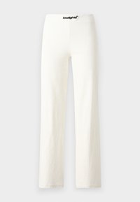 White cotton wide-leg pants with a smooth texture, featuring a black logo waistband and a simple, minimalistic design.