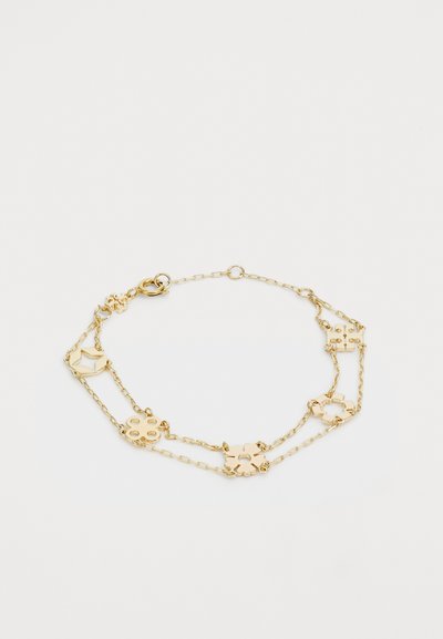 Goldene Kettenarmband mit geometrischen und floralen Formen, alternierenden Gliedern und einem Karabinerverschluss. Glatte metallische Oberfläche.