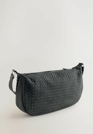 Black woven leather bag with a rectangular shape, a zip closure, and an adjustable strap. Features textured surface and sleek design.