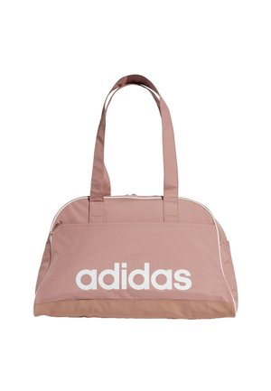 Bolsa deportiva de tela rosa con cierre en la parte superior, dos asas cortas, logo blanco en la parte delantera y ribete blanco contrastante a lo largo de los bordes.