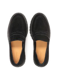Black suede loafers with a textured rubber sole, featuring stitched detailing and a smooth leather lining. No laces or fastenings.