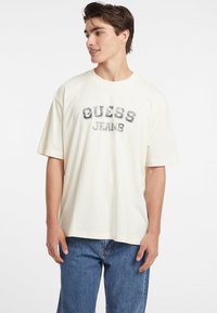 Guess Jeans VINTAGE - Marškinėliai su spaudiniu - creme