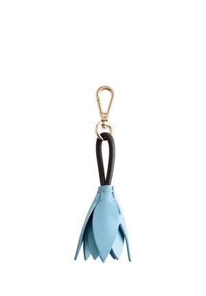 A blue leather keychain in a leaf shape, featuring a black strap and gold metal clasp, highlighting intricate details and a textured finish.