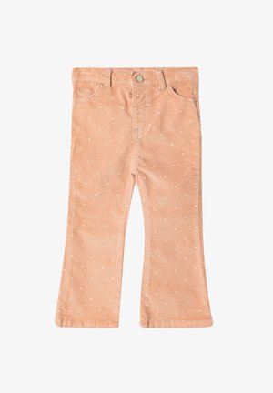 Peachfarvede flared bukser med hvide prikker, lavet af blødt stof, med en frontlukning med knap og almindelige lommer.