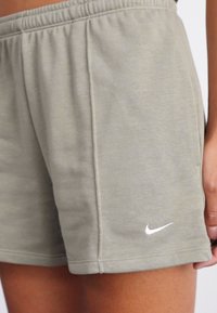Nike Sportswear Calças de fato de treino - light army/sail